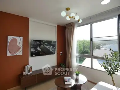 Modern living room with large window and stylish decor