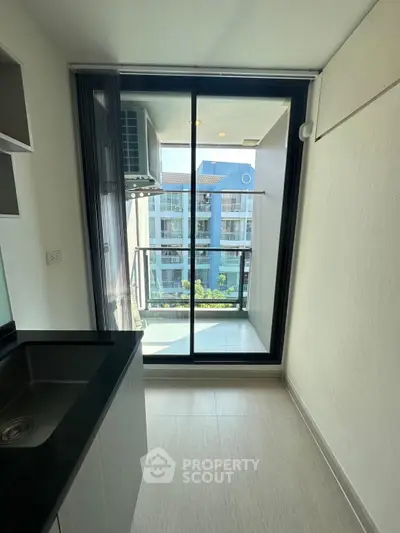 Modern kitchen with balcony view in a stylish apartment