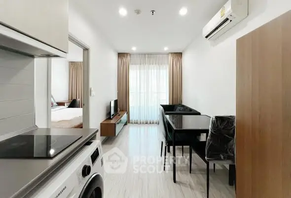 Modern apartment interior with open kitchen and cozy living area