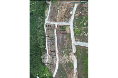 Aerial view of land plots for sale with marked dimensions and sold status.