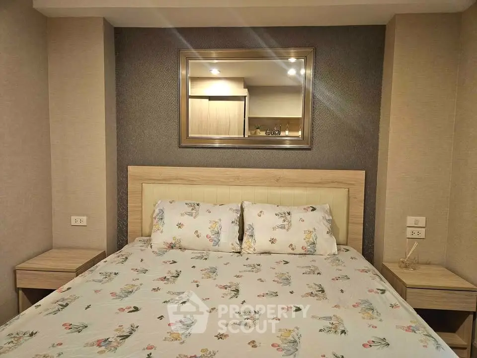 Cozy bedroom with elegant decor and plush bedding in a modern apartment.