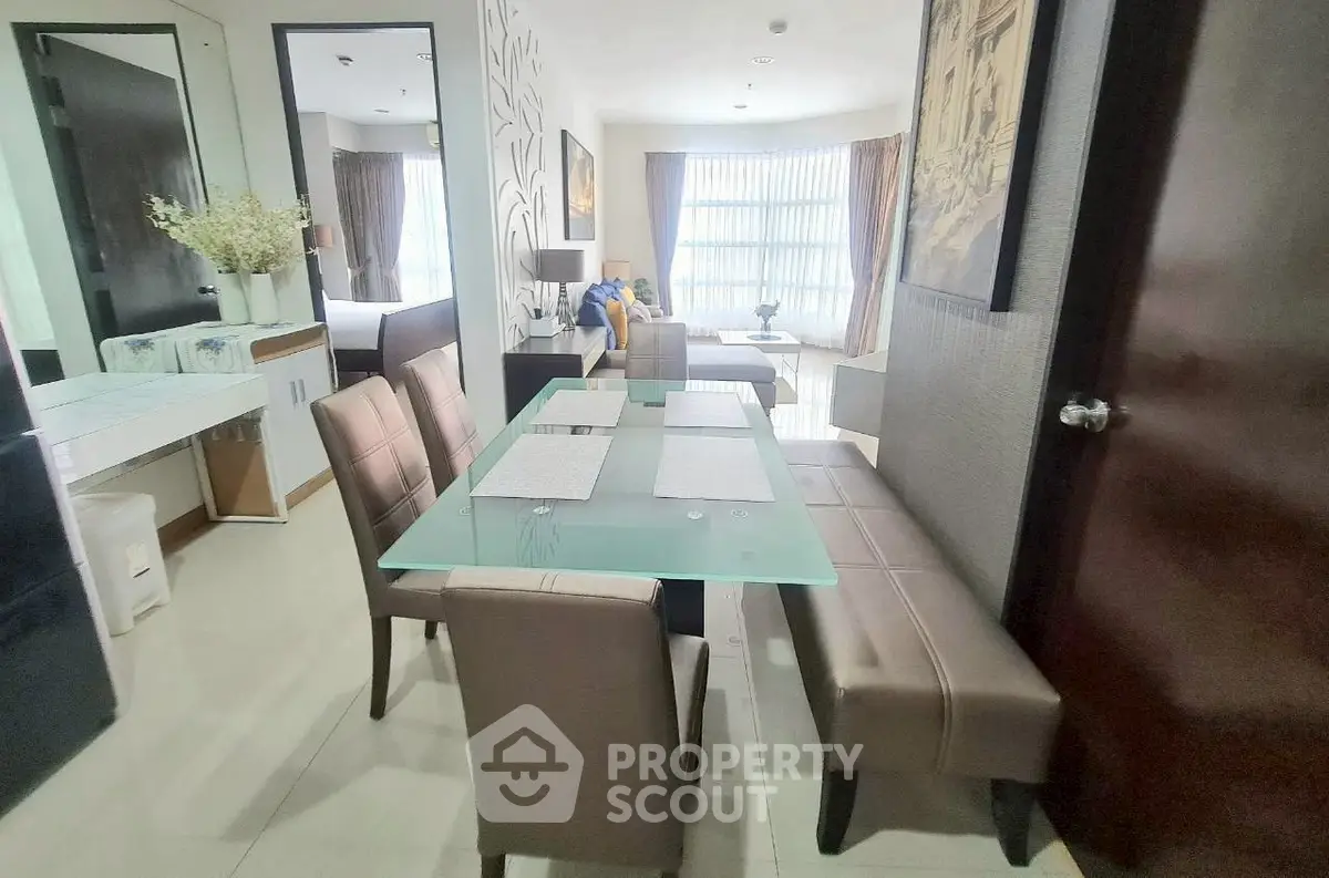Modern dining area with glass table and stylish seating in a contemporary apartment