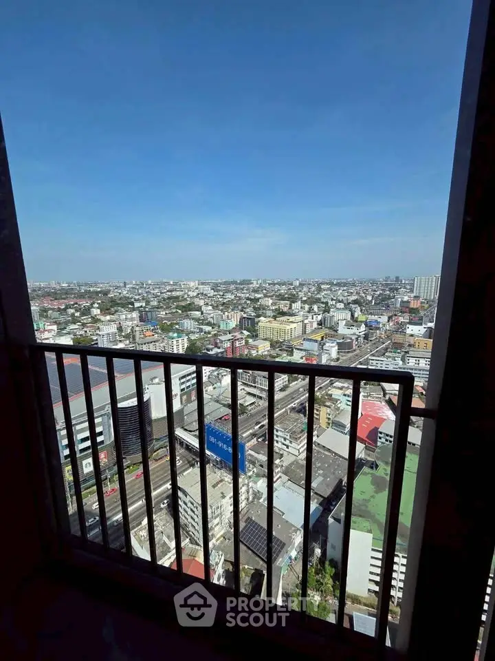 Stunning cityscape view from high-rise balcony, perfect for urban living.