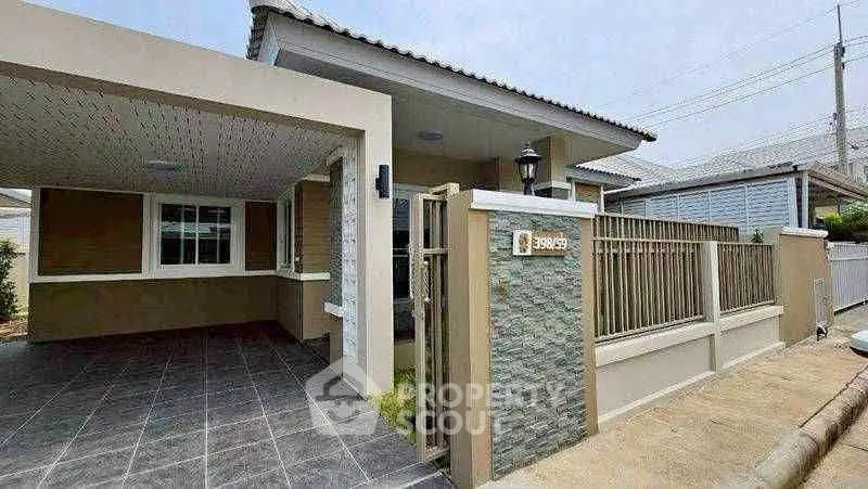 Charming single-story home with covered carport and modern exterior design in a serene neighborhood.
