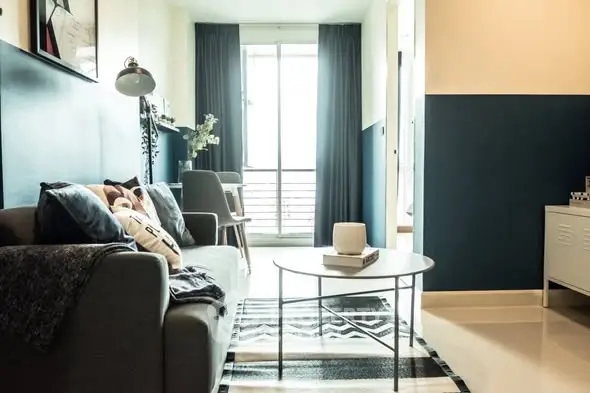 Stylish modern living room with cozy sofa and chic decor, perfect for urban living.