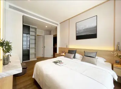 Luxurious modern bedroom with elegant decor and spacious layout, featuring a cozy bed and stylish furnishings.