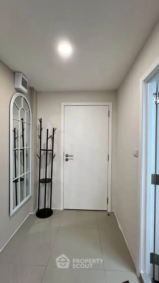 Modern minimalist hallway with sleek design and stylish coat rack