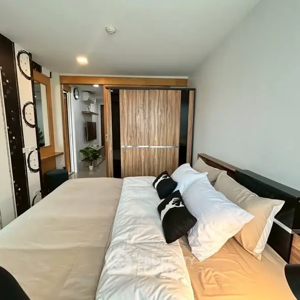 Modern bedroom with stylish decor and cozy bedding