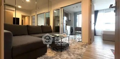 Modern living room with cozy sofa and open layout in stylish apartment