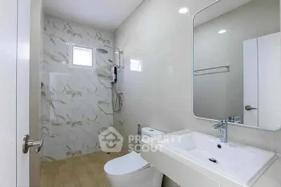 Modern bathroom with elegant marble tiles and sleek fixtures