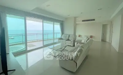 Luxurious living room with stunning ocean view and modern white furniture