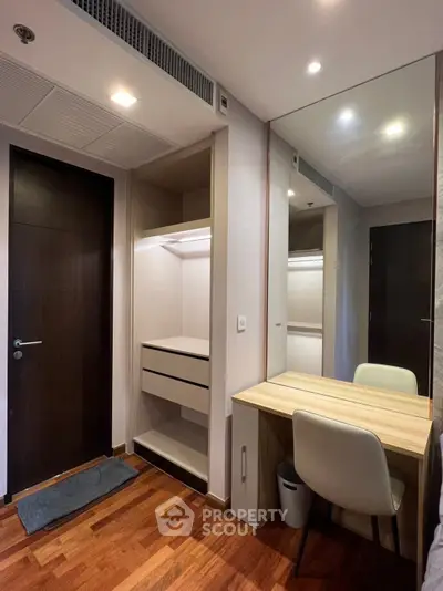 Modern bedroom with built-in closet and stylish wooden desk