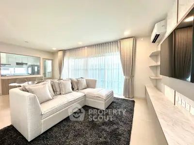Spacious modern living room with elegant decor and natural light