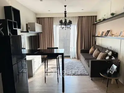 Stylish modern living room with elegant chandelier and cozy seating area.