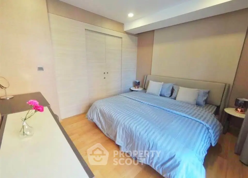 Spacious bedroom with modern decor and cozy ambiance