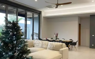 Spacious modern living room with elegant dining area and large windows