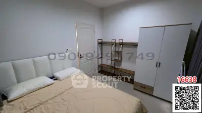 Cozy bedroom with modern furniture and neutral tones, perfect for relaxation and comfort.