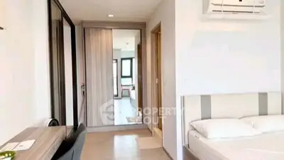 Modern bedroom with sleek design and air conditioning in a stylish apartment.