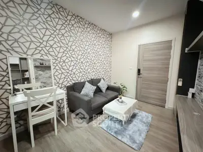 Modern living room with stylish geometric wallpaper and cozy seating area.
