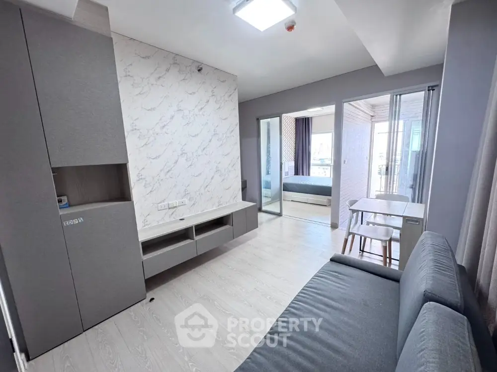 Modern apartment interior with stylish living room and bedroom view