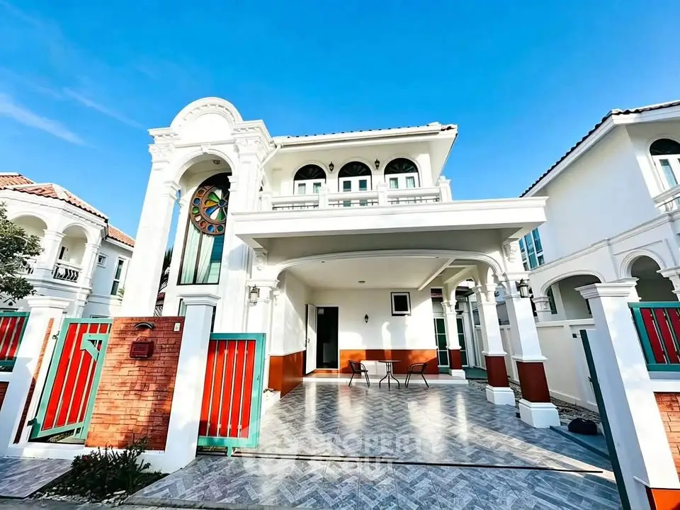 Stunning two-story villa with elegant architecture and spacious driveway in a serene neighborhood.