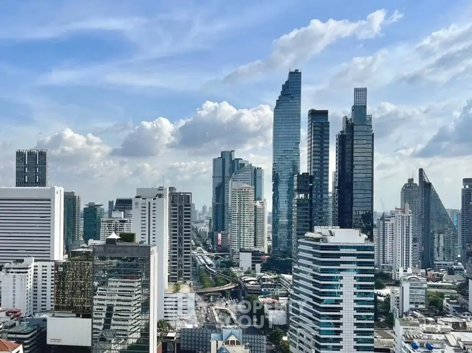 Stunning cityscape view of modern skyscrapers under a vibrant blue sky, showcasing urban living at its finest.