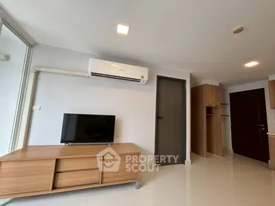 Modern living room with sleek wooden furniture and air conditioning, perfect for comfortable living.