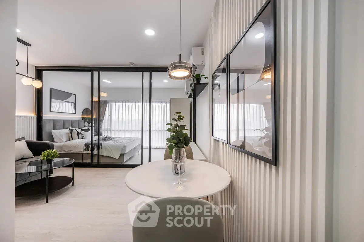 Modern open-plan living room with stylish decor and natural light