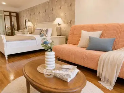 Charming bedroom with cozy seating area and elegant decor