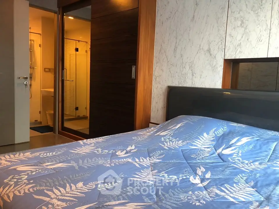 Modern bedroom with ensuite bathroom and stylish decor