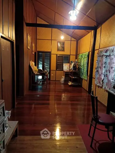 Charming rustic interior with wooden walls and floors, cozy lighting, and traditional decor.