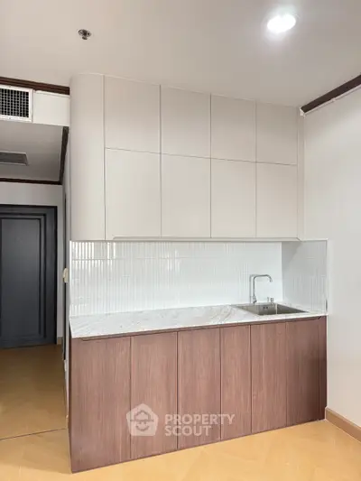 Modern kitchen with sleek cabinetry and minimalist design