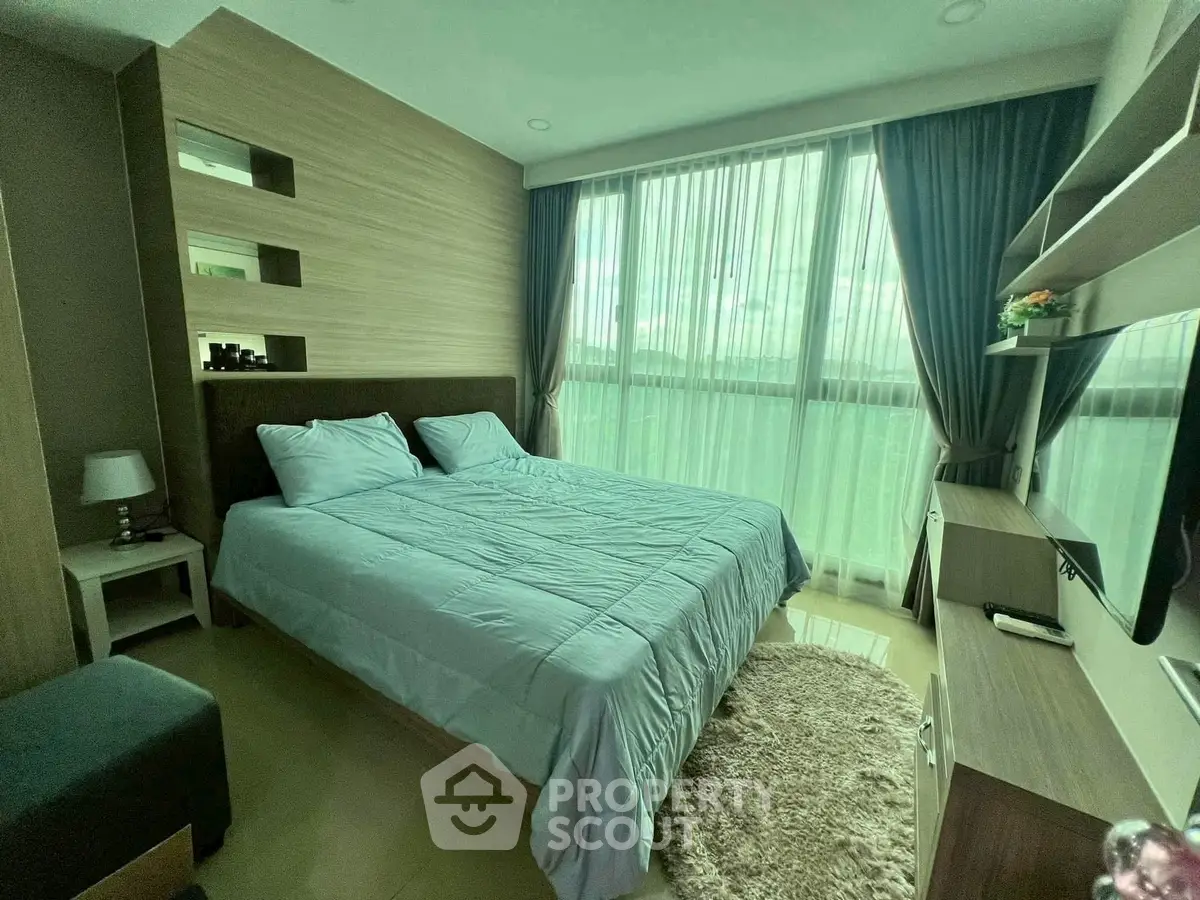 Modern bedroom with large window, cozy bed, and stylish decor in a luxurious apartment.