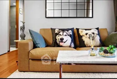 Stylish living room with cozy sofa and decorative pillows, modern decor and elegant coffee table.