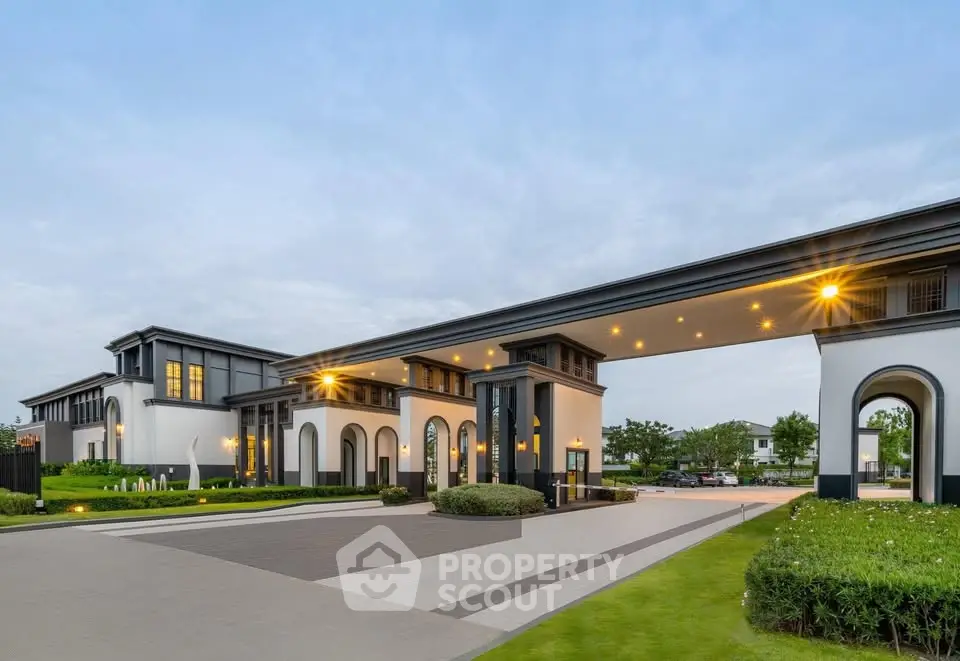 Luxurious modern building entrance with elegant architecture and landscaped surroundings
