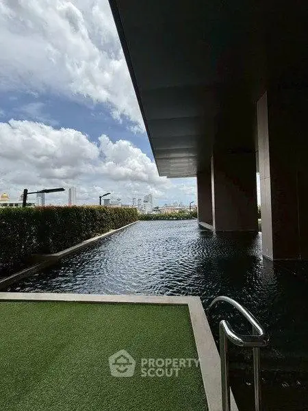 Luxurious rooftop pool with stunning city view and modern design.