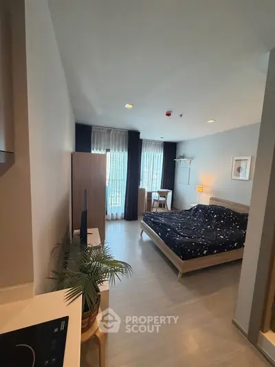 Modern bedroom with stylish decor and natural light