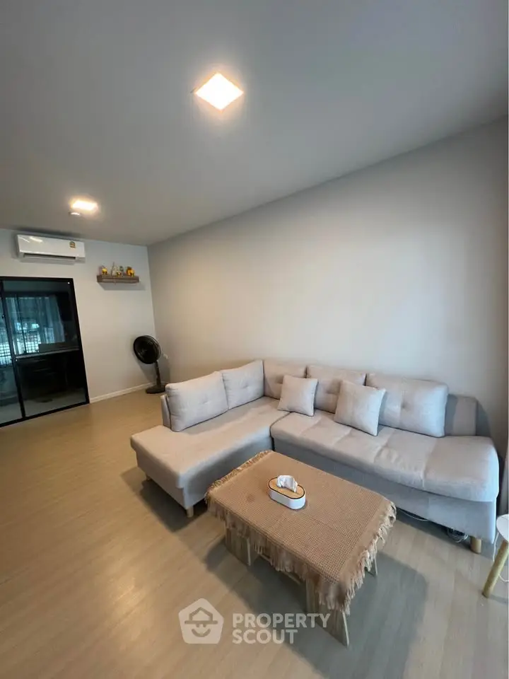 Modern living room with cozy sectional sofa and minimalist decor