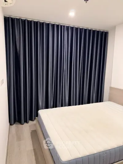 Modern bedroom with sleek curtains and minimalist design