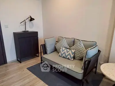 Cozy living room with modern sofa and stylish lamp in a contemporary apartment.