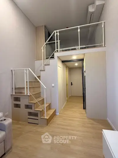 Modern duplex apartment with mezzanine and stylish staircase