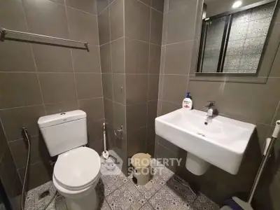 Modern bathroom with sleek tiles and contemporary fixtures