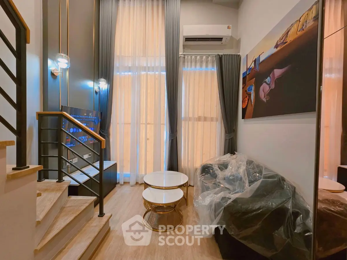 Modern living room with high ceilings and stylish decor