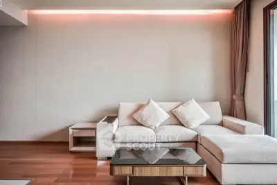 Modern living room with stylish sofa and elegant wooden flooring