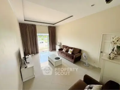 Spacious living room with modern decor and natural light