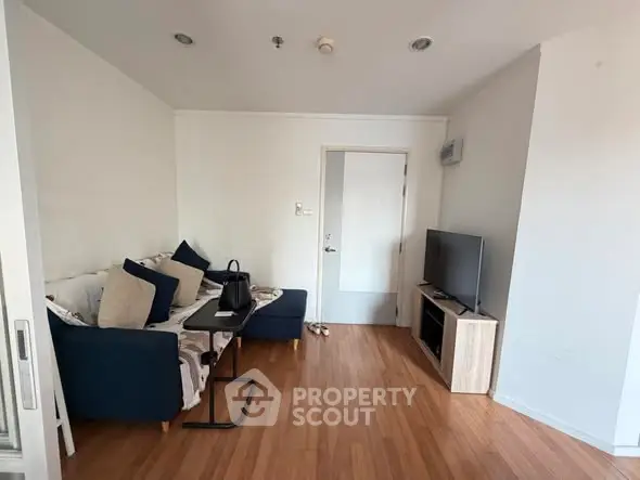 Cozy living room with wooden flooring and modern furniture