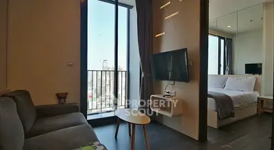 Modern apartment with cozy living area and city view balcony