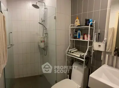 Modern bathroom with glass shower and organized storage