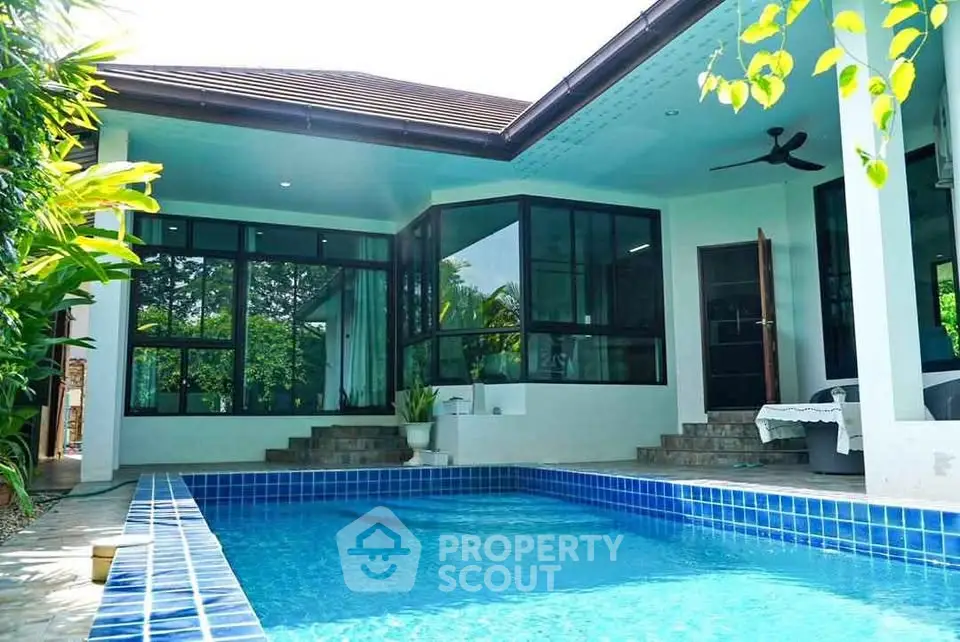 Stunning modern home with private pool and lush greenery, perfect for luxury living.