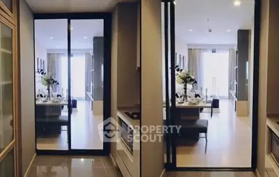 Modern interior with sliding glass doors leading to a stylish dining area